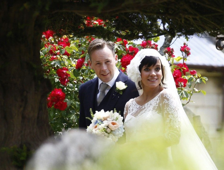 British singer Lily Allen smiles after marrying Sam Cooper as the couple leaves St James the Great Church in Cranham