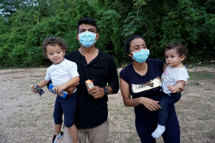 Honduran cousins Onan Gutierrez (left) and Gloria Amador Gutierrez, each holding their daughters, tried to reach the United States but were deported by Mexican authorities to Guatemala