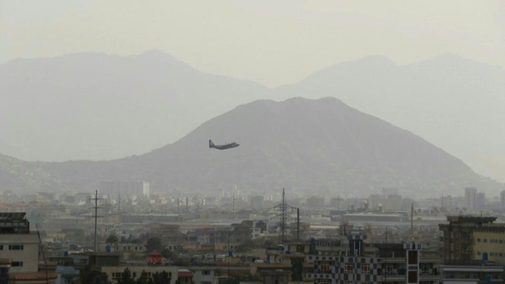 Airplanes land and take off at Kabul airport as evacuations continue