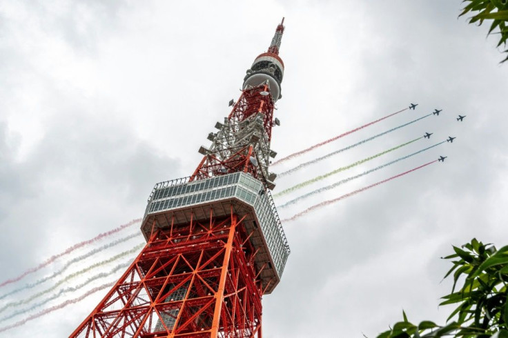 Crowds gathered in parts of Tokyo to watch the Blue Impulse air display team