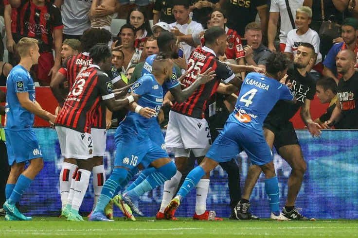 Flashpoint: Marseille's French midfielder Dimitri Payet (centre) reacts as players stop a fan invading the pitch