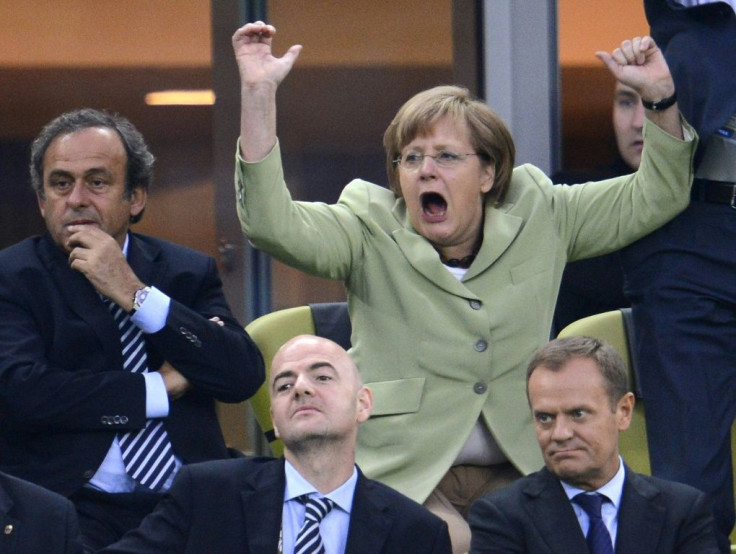 Merkel, celebrating a goal at the 2012 Euro 2012 championships, is known for her football fervour