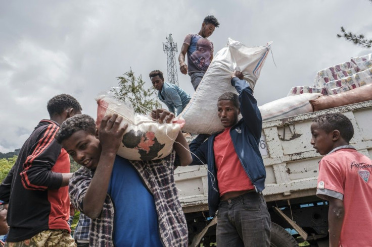 Displaced civilians depend on food and handouts from local residents