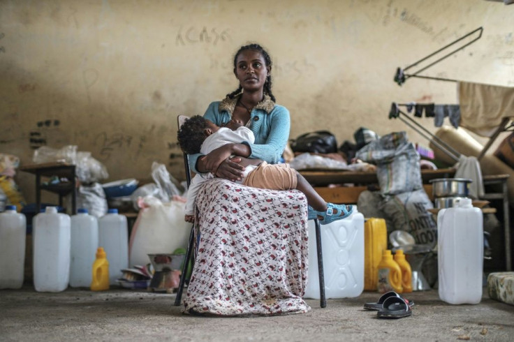 A woman and her baby displaced by fighting in northern Ethiopia have found temporary shelter at the Addis Fana School in Dessie