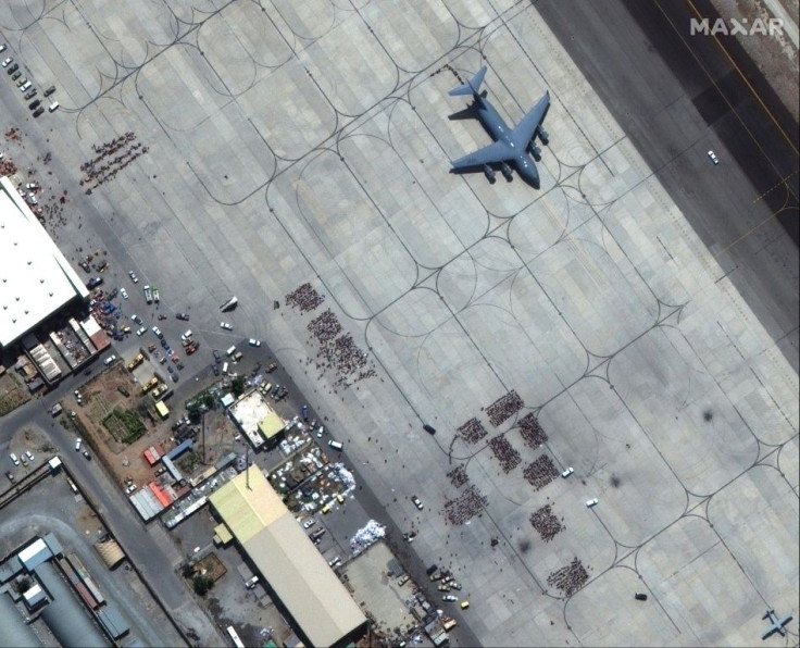 A satellite image by Maxar Technologies shows crowds of people waiting on the tarmac at Kabulâs Hamid Karzai International Airport in Afghanistan