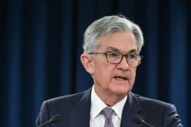 Federal Reserve Board Chair Jerome Powell might wait before announcing details on tapering the central bank's bond buying
