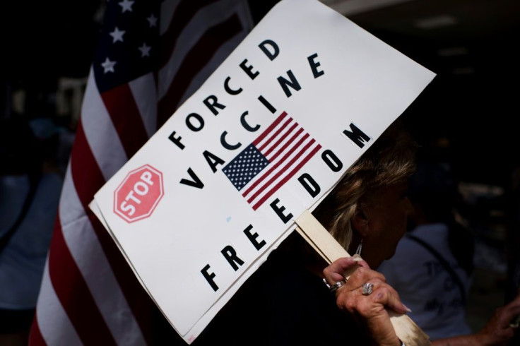 Anti-vaccine rally protesters hold signs outside of Houston Methodist Hospital in June 2021 - employees had sought to overturn a vaccine mandate, but their case was dismissed in a federal court