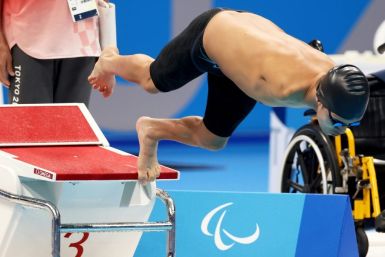 Abbas Karimi of the Refugee Paralympic Team competes in the men's S5 50m butterfly