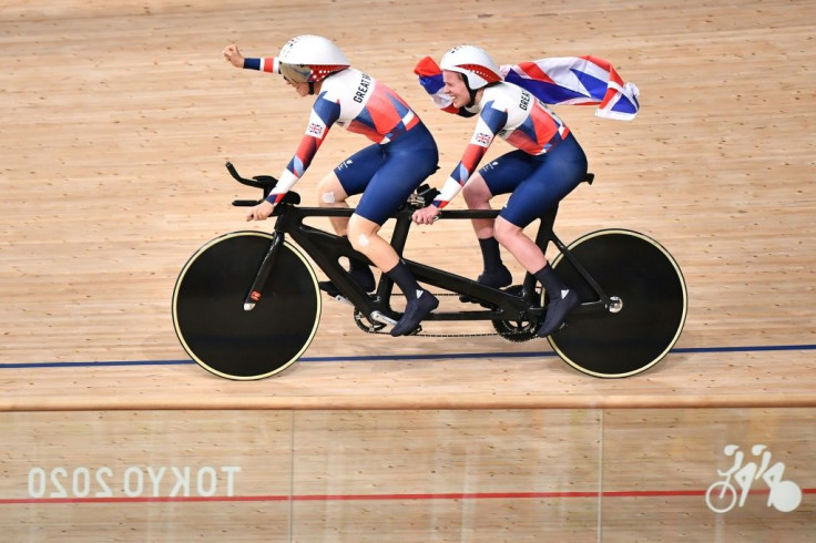 Britain's Lora Fachie and her pilot Corrine Hall celebrate victory in the women's B 3000m individual pursuit final. Fachie's husband Neil also won a cycling gold