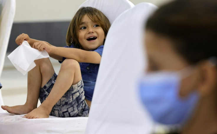 A young refugee from Afghanistan pictured at a transit facility in the Emirati capital Abu Dhabi