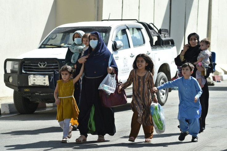 A steady stream of buses was disgorging passengers at Kabul's airport and they were allowed to cross to the American held part for evacuation