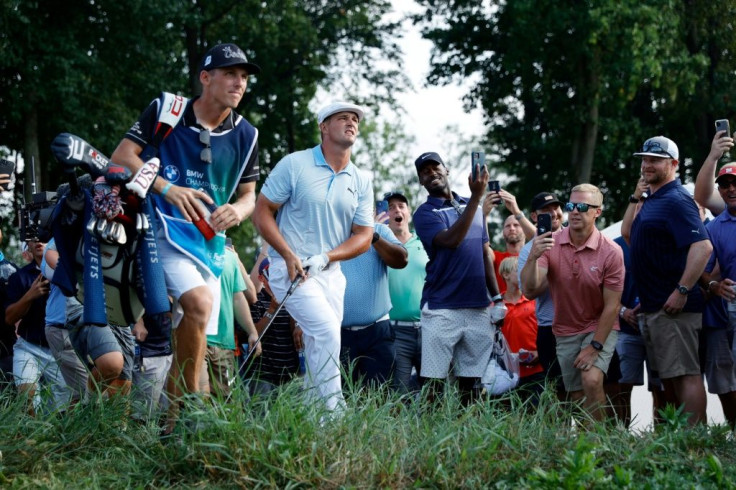 Off target: American Bryson DeChambeau plays out of the rough on the way to a five-under par 67 and a share of the third-round lead in the US PGA Tour BMW Championship