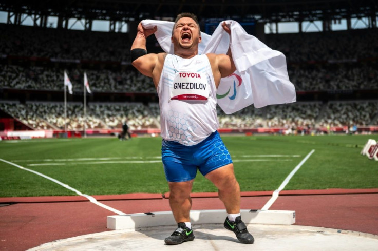 Russian Paralympic Committee's Denis Gnezdilov celebrates after winning gold in the men's shot put F40 final at the Tokyo Paralympic Games