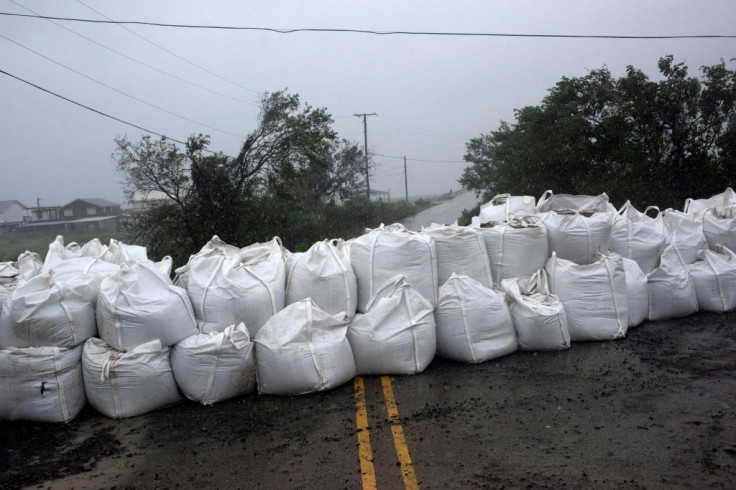 Rain comes down on a wall of sandbags in Montegut, Louisiana before the arrival of Hurricane Ida on August 29, 2021