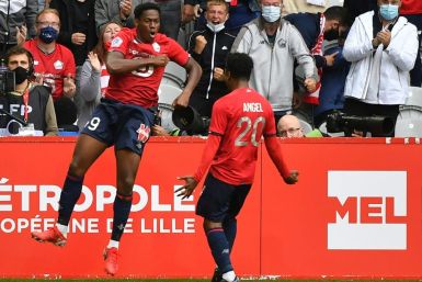 Jonathan David (L) celebrates after scoring Lille's winner against Montpellier