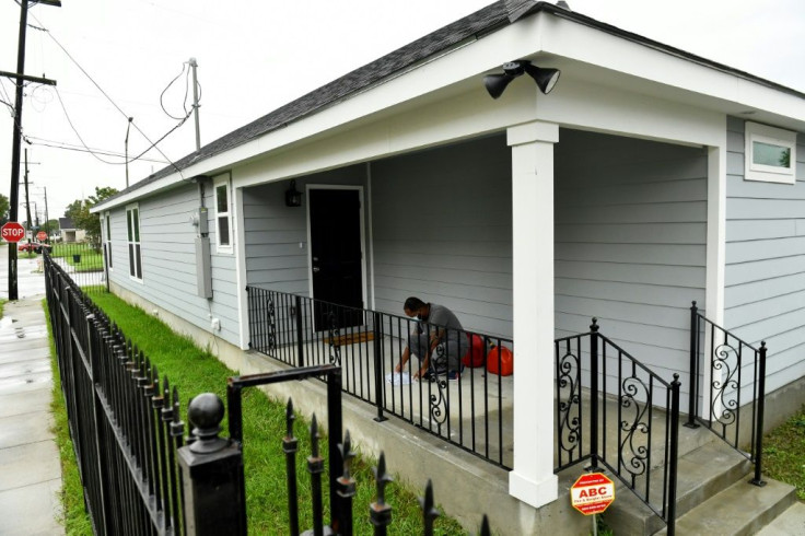 Peter Torregiano, 42, checks the instructions for his generator as he prepares to wait out Hurricane Ida from his recently built home in the Lower Ninth Ward neighborhood of New Orleans, Louisiana