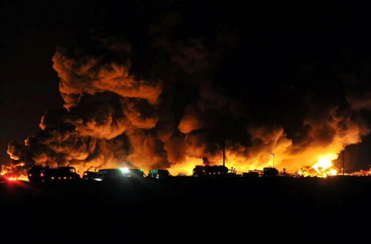 Kuwaiti firemen fight a massive blaze in a dump of more than five million used tyres in Kuwait on April 17, 2012