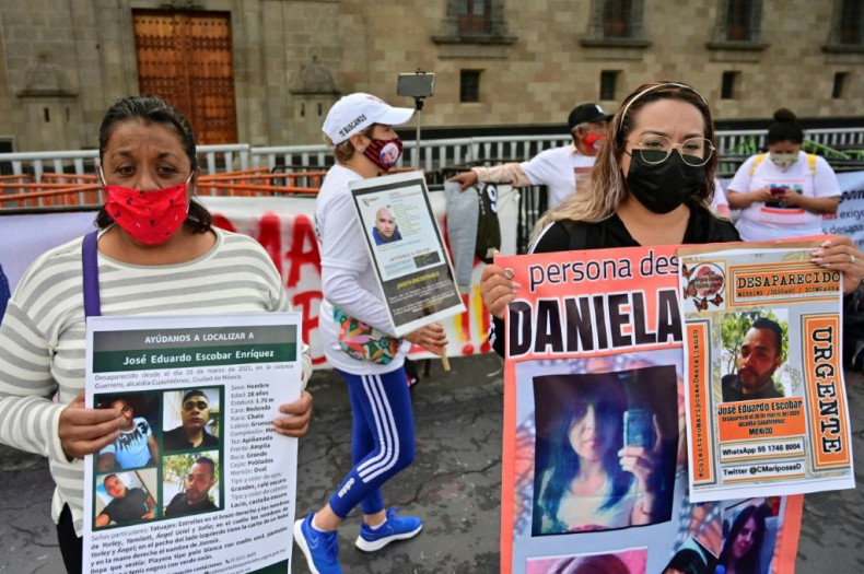Relatives of missing Mexicans protest outside the presidential palace on International Day of the Victims of Enforced Disappearances