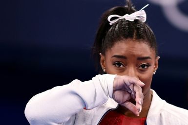 Simone Biles says the mental health issues that disrupted her Olympic campaign began before she arrived in Tokyo
