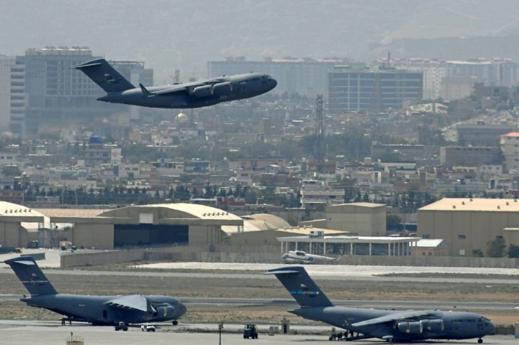 A US Air Force aircraft takes off from the airport in Kabul hours before the American withdrawal was completed after 20 years of war