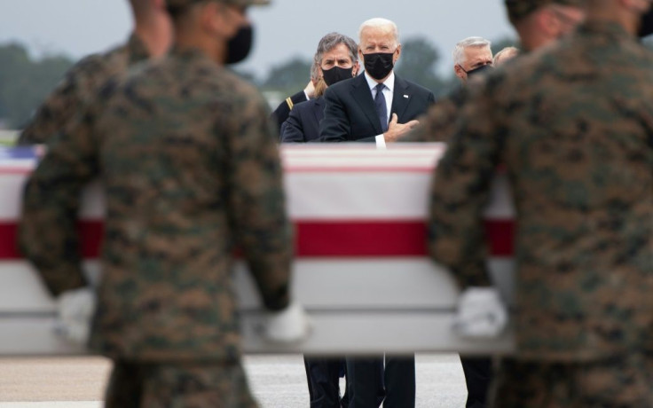 US President Joe Biden(C) attends the ceremony for the return of the remains of 13 US service members killed in Kabul days before the final US military withdrawal from Afghanistan