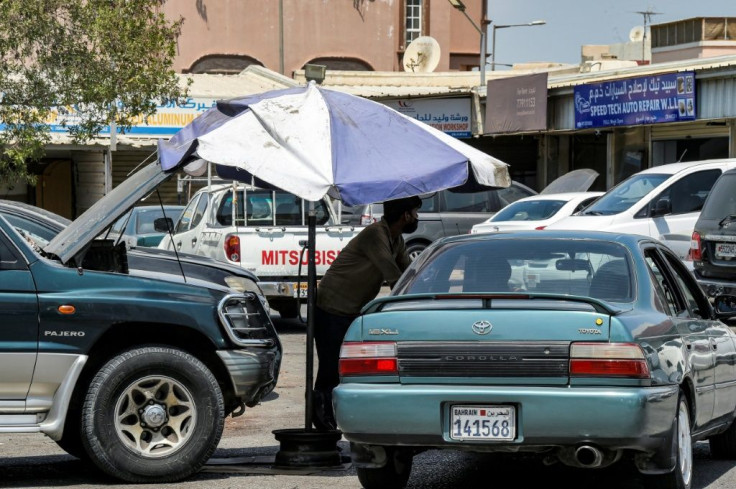 Mechanics work in Isa Town, south of Bahrain's capital Manama. Average summer temperatures in the country range between 35C and 40C