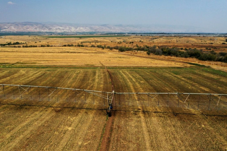 Agricultural fields are seen near the border with Jordan (background). Assessments show Israel does not have enough land to ramp up the necessary solar production to meet its Paris accord commitments, so it will have to buy solar power from Jordan