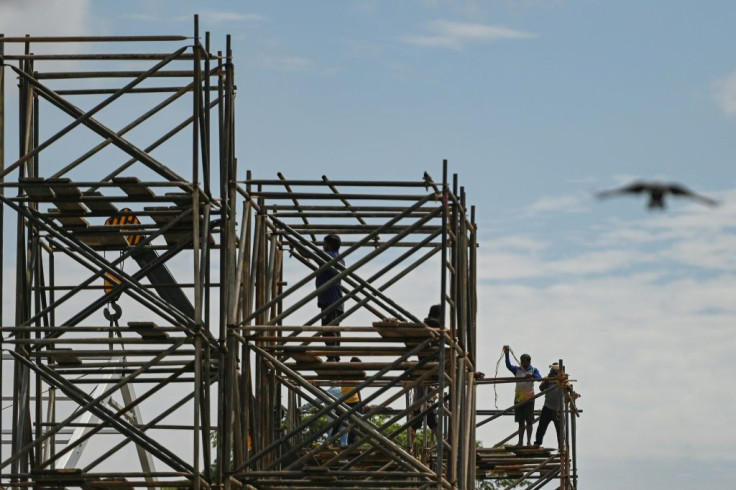 Labourers work on scaffolding in the Indian financial hub of Mumbai