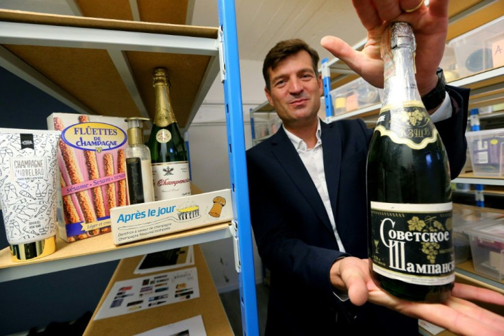 CIVC boss Charles Goemaere shows Russian sparkling wine which has hijacked the champagne name