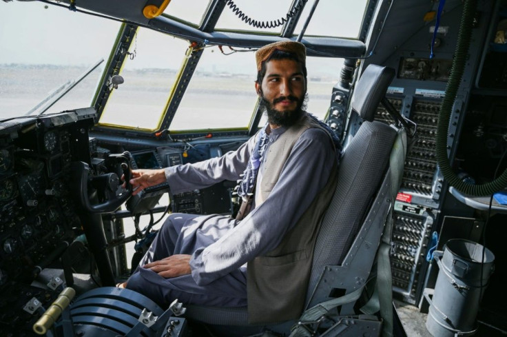 The United States believes it still has leverage over the Taliban -- but, like this fighter pictured in the cockpit of an Afghan Air Force aircraft in Kabul on August 31, 2021, they may see themselves in the driver's seat, analysts warn