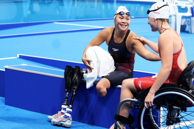 US swimmer Haven Shepherd (L) lost her legs as a baby after her parents detonated a bomb intended to kill the whole family