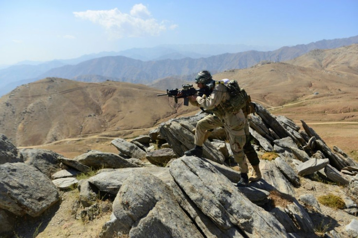 Afghan anti-Taliban forces patrol a hilltop in Panjshir province on September 1, 2021