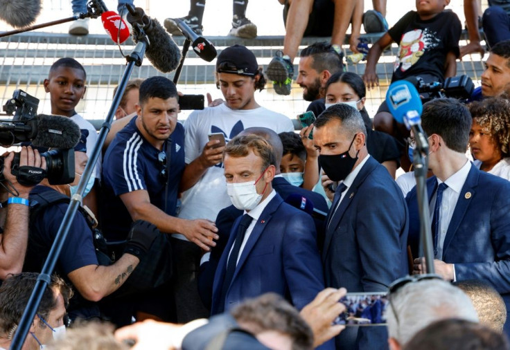 Macron met residents of the rundown district of Bassens on the first day of a three-day visit to Marseille
