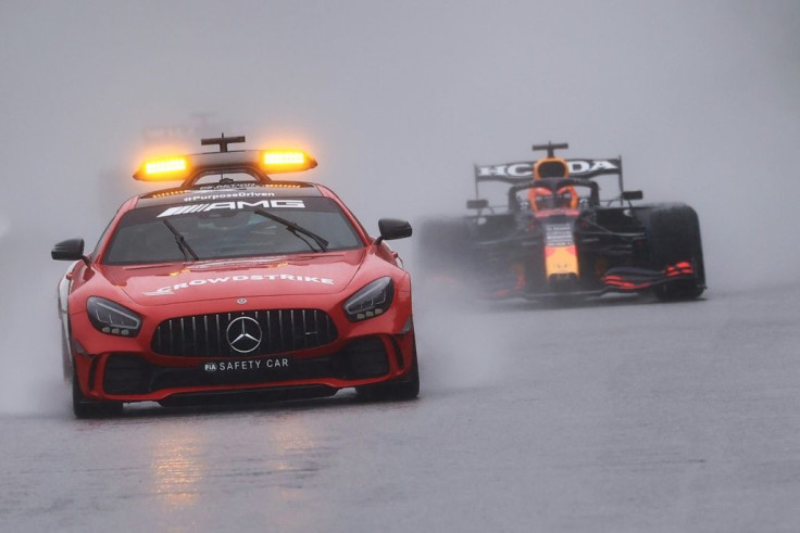 Damp squib: Max Verstappen followed the safety car for two laps at Spa-Francorchamps to claim a hollow victory and half points