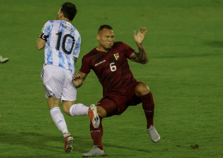 Venezuelan Luis Adrian Martinez's rash challenge on Argentina's Lionel Messi (left) earned him a straight red card