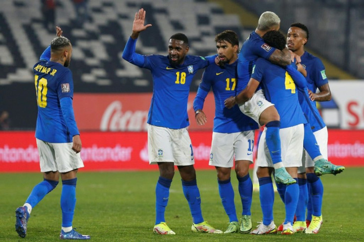 Brazil's players celebrate Everton Ribeiro's winner against Chile that maintained their perfect start to World Cup qualifying