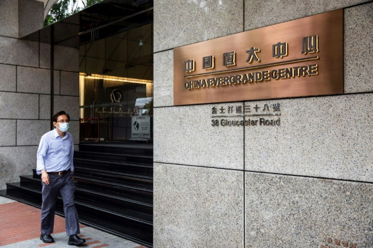 Evergrande has warned it has total liabilities of $305 billion and it faced 'risks of defaults on borrowings'