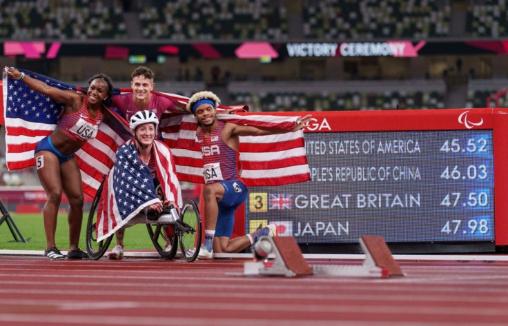 USA's Brittni Mason, Tatyana McFadden, Nick Mayhugh, and Noah Malone celebrate winning the 4x100m universal relay