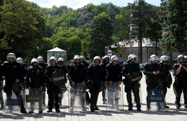 Riot police have been deployed around the monastery