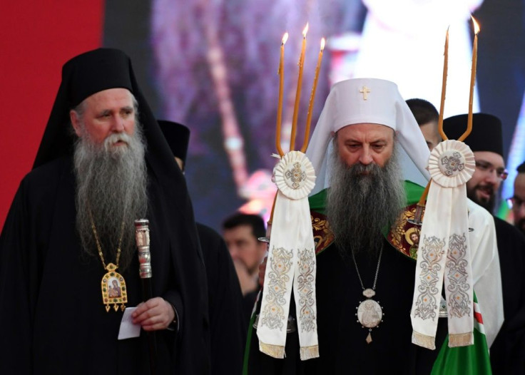 Joanikije (L) and Patriarch Porfirije (R) were dropped off by helicopter on the monastery's lawn and rushed in under the sound of bells