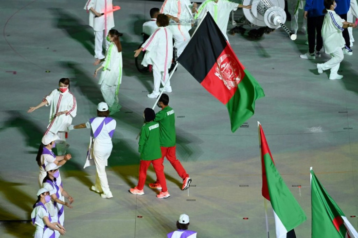Afghanistan's Hossain Rasouli and Zakia Khudadadi carried their country's flag at the Paralympic closing ceremony