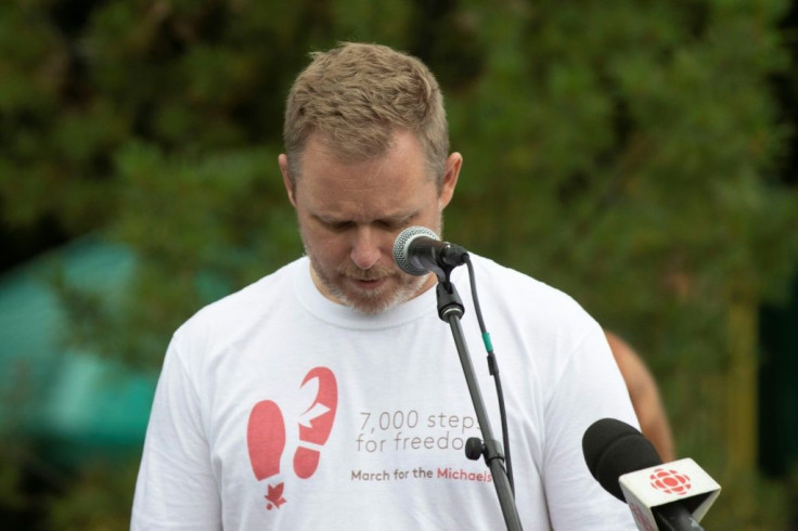 Paul Spavor pauses while speaking to supporters of his brother, Michael Spavor, and Michael Kovrig, as demonstrators gather ahead of a 5 kilometer walk in Ottawa, Ontario on September 5, 2021, to mark the pair's 1,000 days in a Chinese prison
