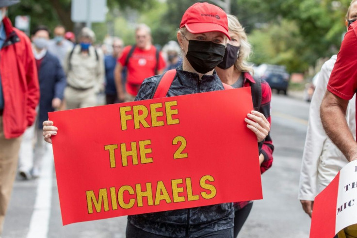 Supporters of Michael Kovrig and Michael Spavor take part in a 5-kilometer walk in Ottawa, Ontario on September 5, 2021, to mark the pair's 1,000 days in Chinese custody after they were charged with espionage