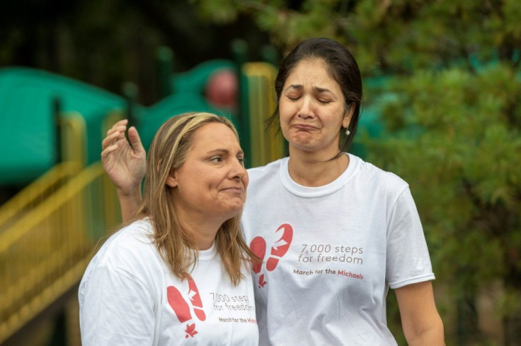 The wife of Michael Kovrig, Vina Nadjibulla (R), and the sister of Michael Kovrig, Ariana Botha, ahead of a 5 kilometer walk in Ottawa, Ontario on September 5, 2021 marking the men's 1,000 days in a Chinese prison