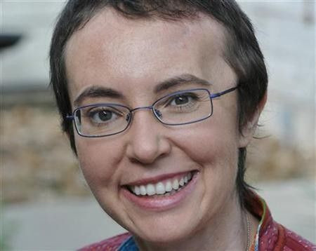 Congresswoman Gabrielle Giffords smiles at TIRR Memorial Hermann Hospital in Houston, the day after the launch of Endeavour and the day before her cranioplasty, in this May 17, 2011 photo released on her Facebook page June 12, 2011.