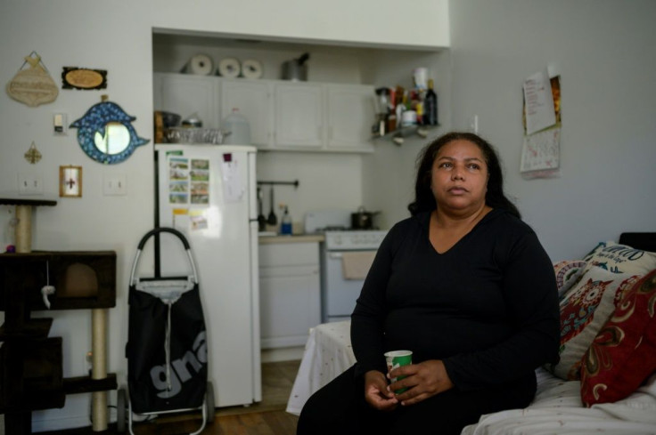 Rubiela Arias poses for a photo in the room she rents in Jackson Heights, in the New York borough of Queens, on May 27, 2021