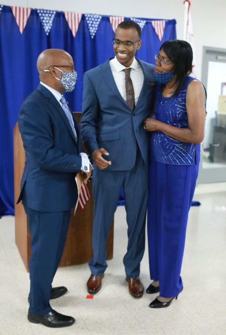 Joel Caston (C), is pictured with his mother Mattie Caston, after being sworn in by Judge Milton Lee Jr in the DC Jail in June 2021