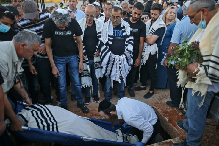 Israeli mourners attend the funeral of Yigal Yehoshua in the city of Modiin on May 18