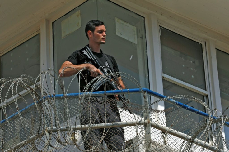 A police officer keeps watch from an observation tower at the Gilboa Prison