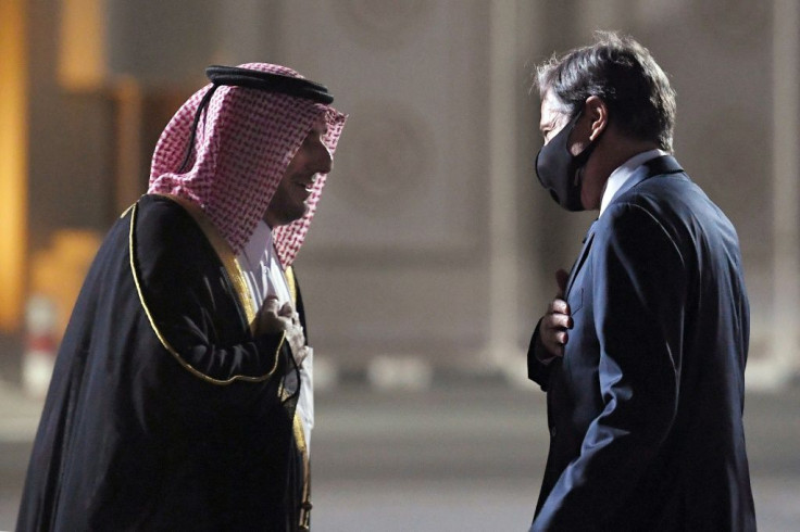Secretary of State Antony Blinken (R), seen here being greeted by a Qatari diplomat upon his arrival in the Gulf state, is the most senior US official to visit the region since the Taliban's lightning takeover of Afghanistan on August 15